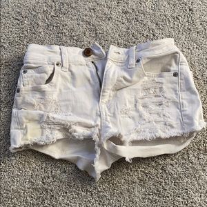 White ripped jean shorts
